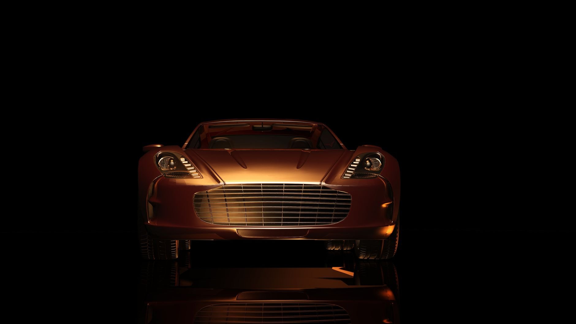Front view of a luxurious sports car in a dark setting, showcasing elegance and design.